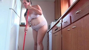 Mother enjoys cleaning the kitchen nude